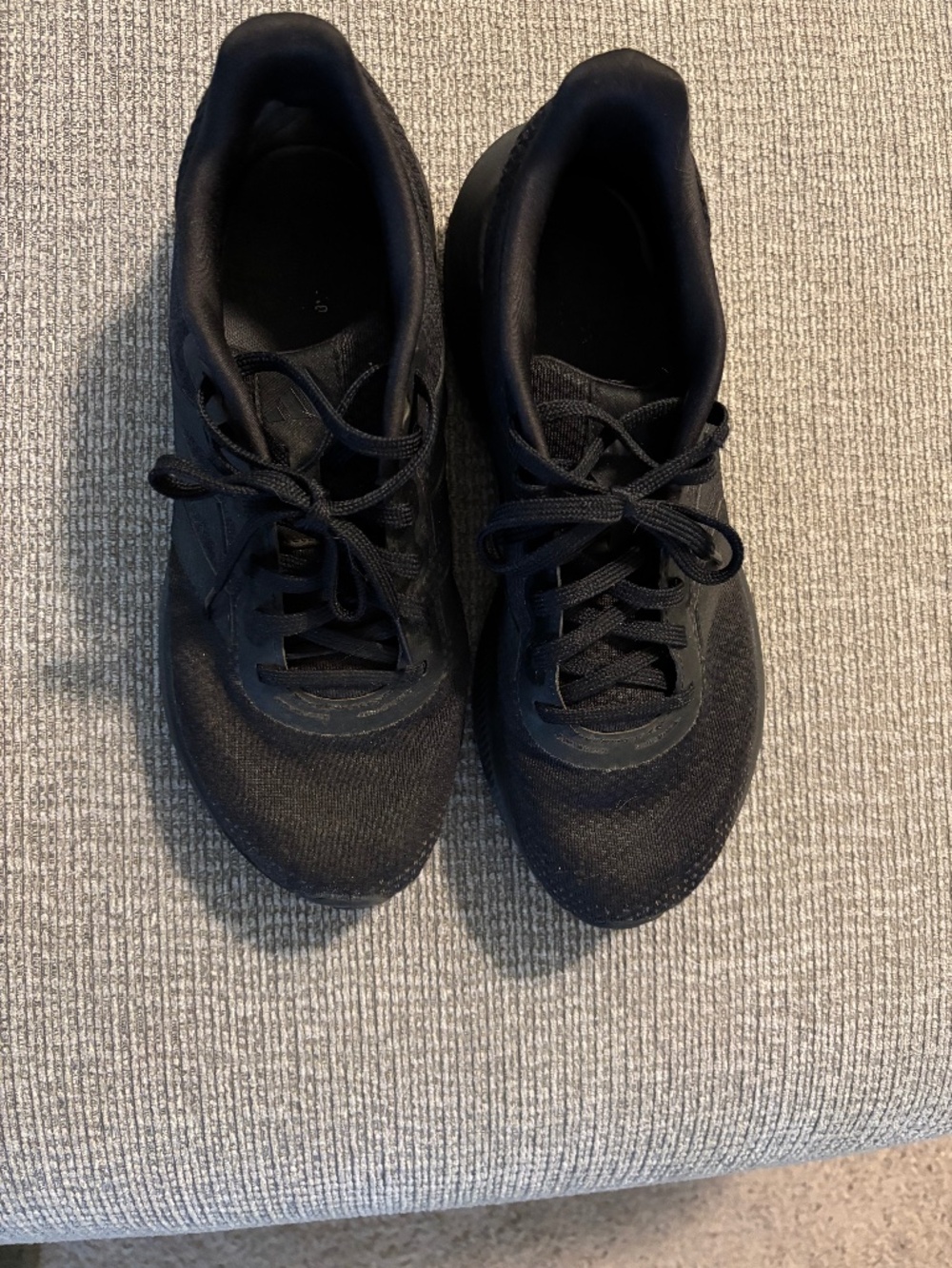 Black Adidas sneakers